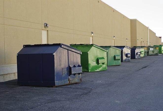 construction dumpsters stacked in a row on a job site in Banning CA